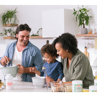 Healthy Heights Kidz Protein Shake Canister – Ages 2+ - Happy family in kitchen making healthy shake with Healthy Heights pediatrician-developed growth shake canisters on counter. - Healthy Heights