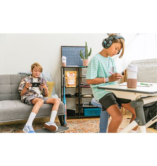 Healthy Heights Grow Daily Protein Shake for Boys – Ages 10+ - Two active boys in casual clothes engage in play and study, highlighting Healthy Heights growth shake on shelf supporting. - Healthy Heights